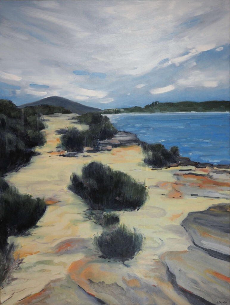 An expressive oil painting of the rocky coastline leading towards Merry Beach on the New South Wales south coast. Pale sandstone, low coastal shrubs and calm blue water stretch towards distant headlands beneath a wide, cloud-filled sky. Loose brushwork and a muted palette create a peaceful sense of space and atmosphere.